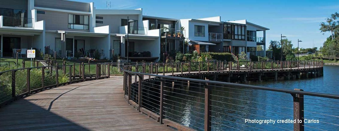 Pre-treated spotted gum timber decking with a protective coating